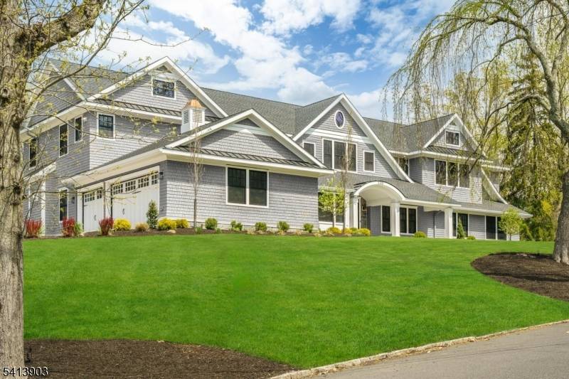 Luxury Nantucket style blended with refined modern touches, this expansive 7 bedroom home with 6 full baths and 2 half baths delivers grandeur and comfort.