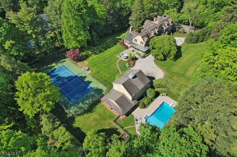 This beautifully restored and expanded Dutch Colonial in HoHoKus spans over 8900 sqft across 1.