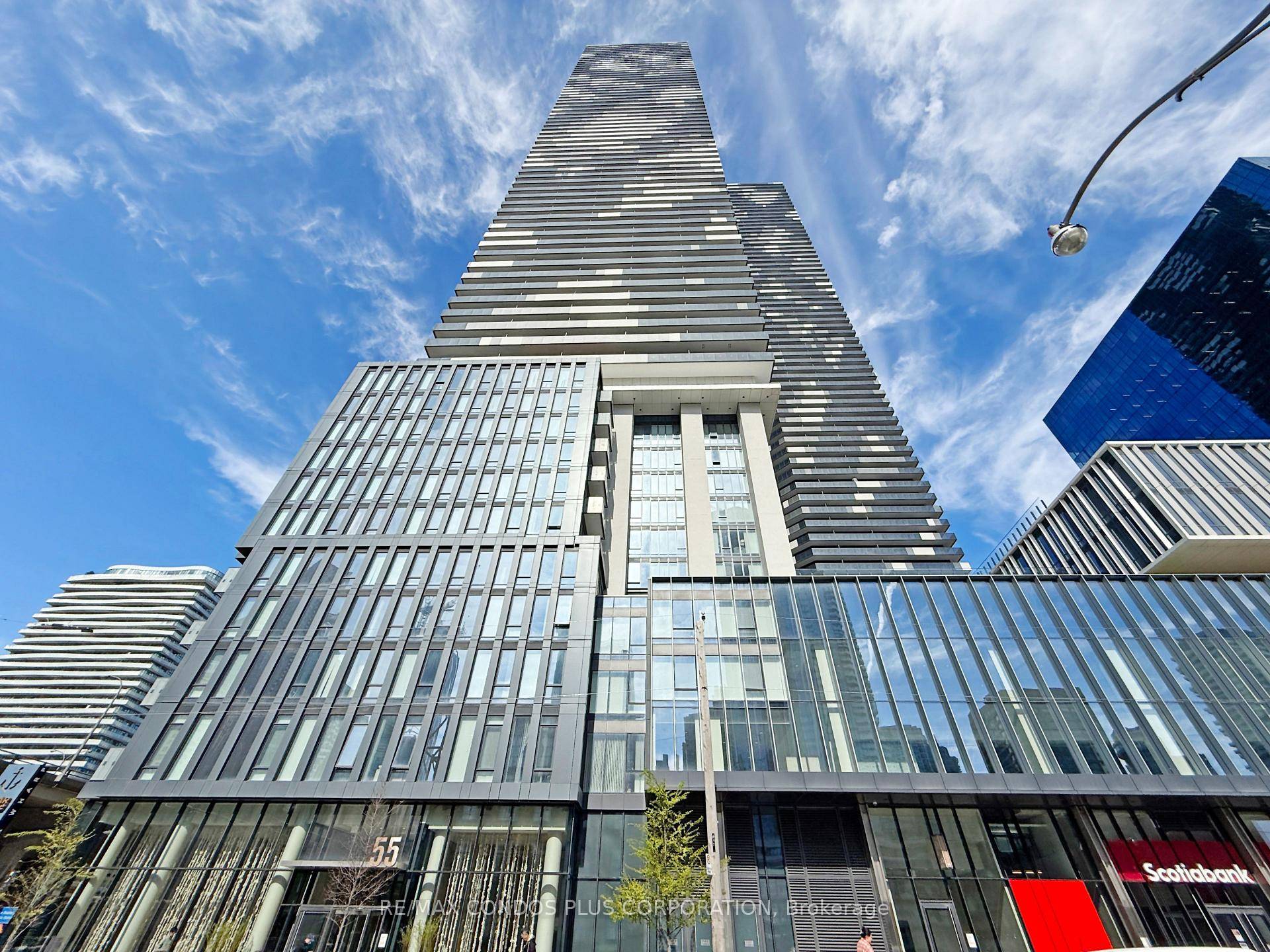 1 Den unit with 1 bath in family oriented Sugar Wharf condos by Menkes, offering 664 sq.