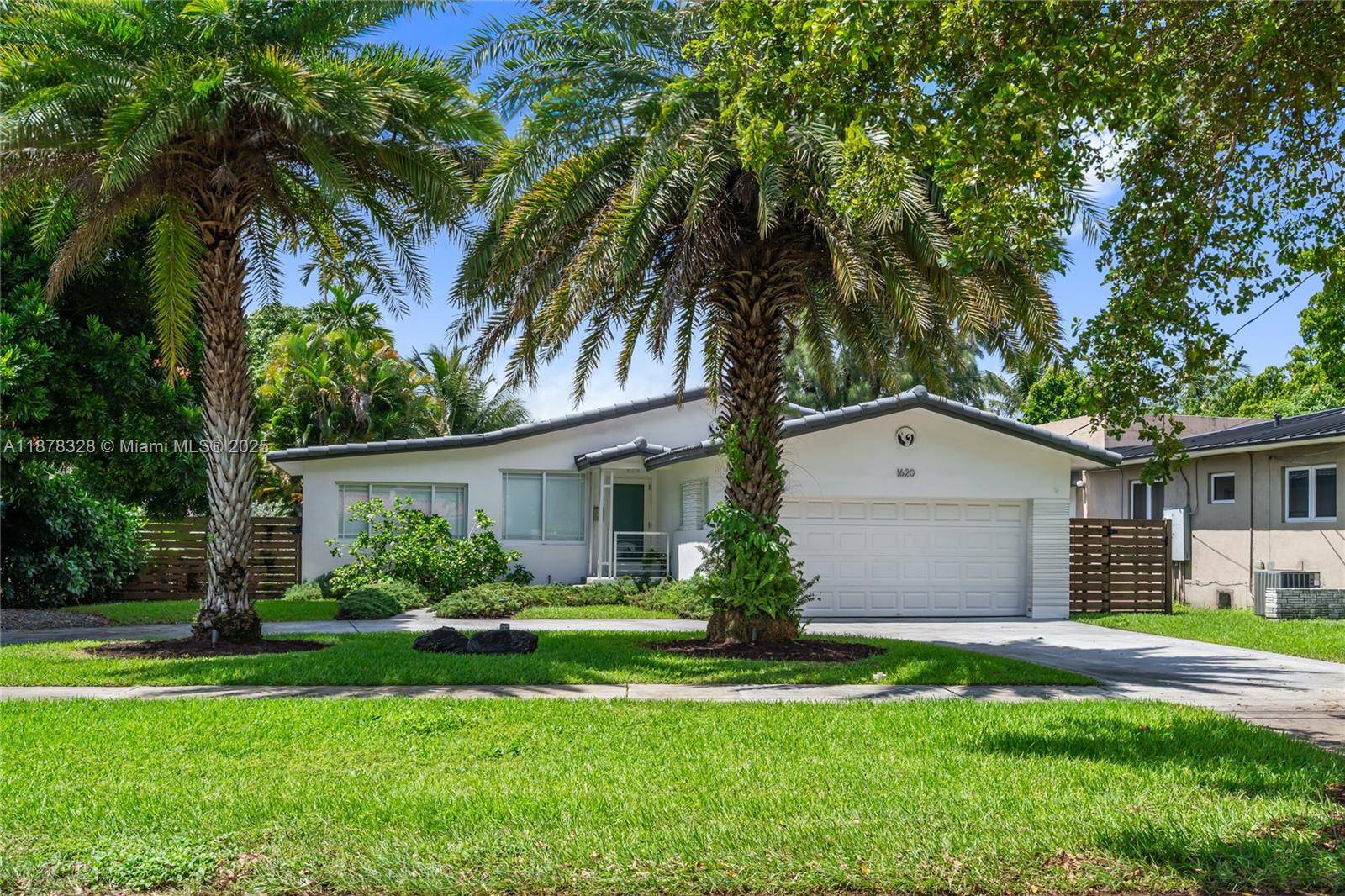 Welcome to this inviting 3 bed, 2 bath, BASS LAKE home located in the highly desirable Bird Section of Miami Springs.