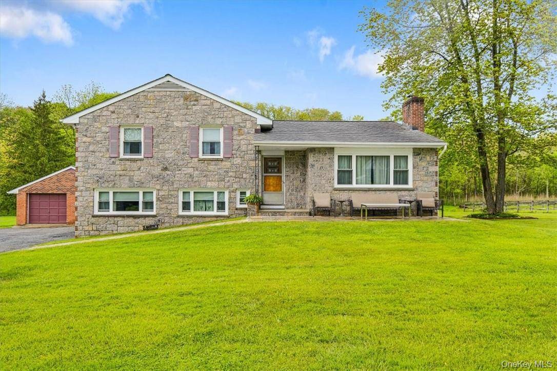 Immaculate 3 bedroom, 2 bath Split Level home set on almost 2 picturesque acres within walking distance of serene reservoir views.