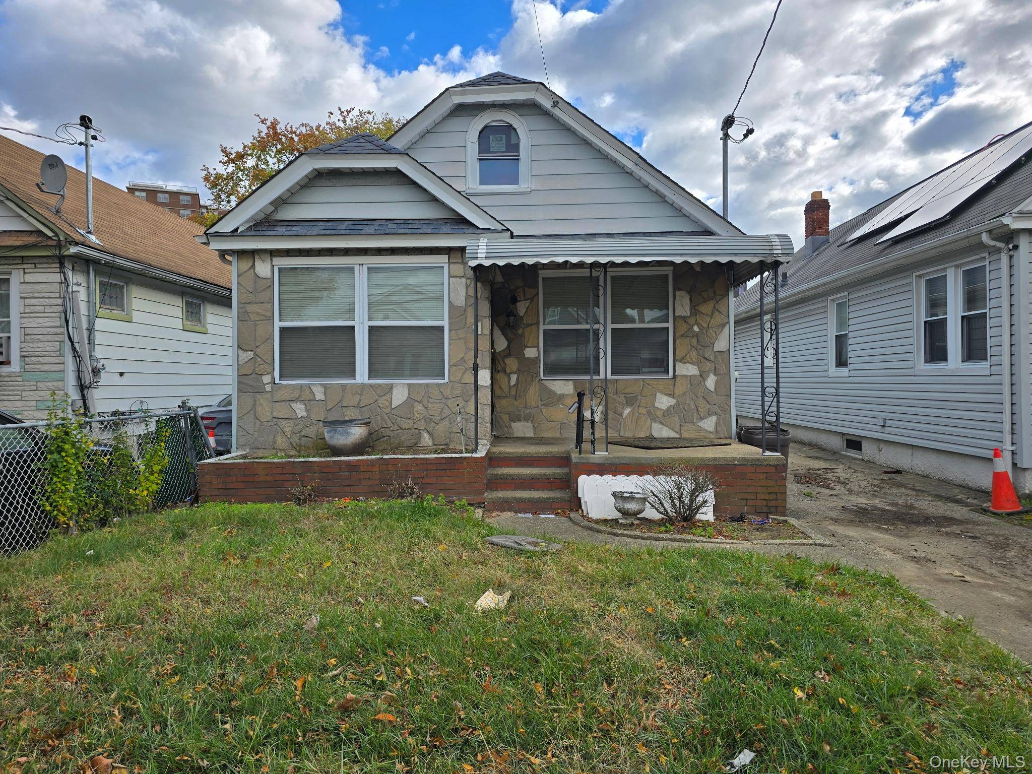 Single Family home located in Jamaica Queens, including kitchen, living room, 2 bedrooms, 1 full bathroom, half bathroom, full finished basement and partially finished attic.