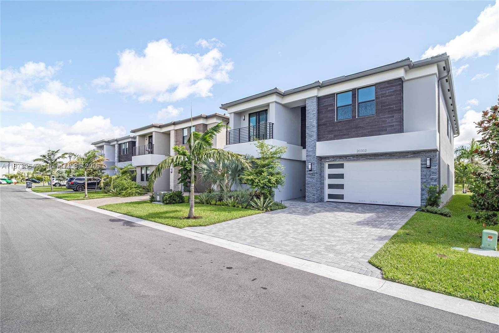 Experience a luxury lifestyle lakefront home built in 2024 at Lotus Palms, Boca Raton.