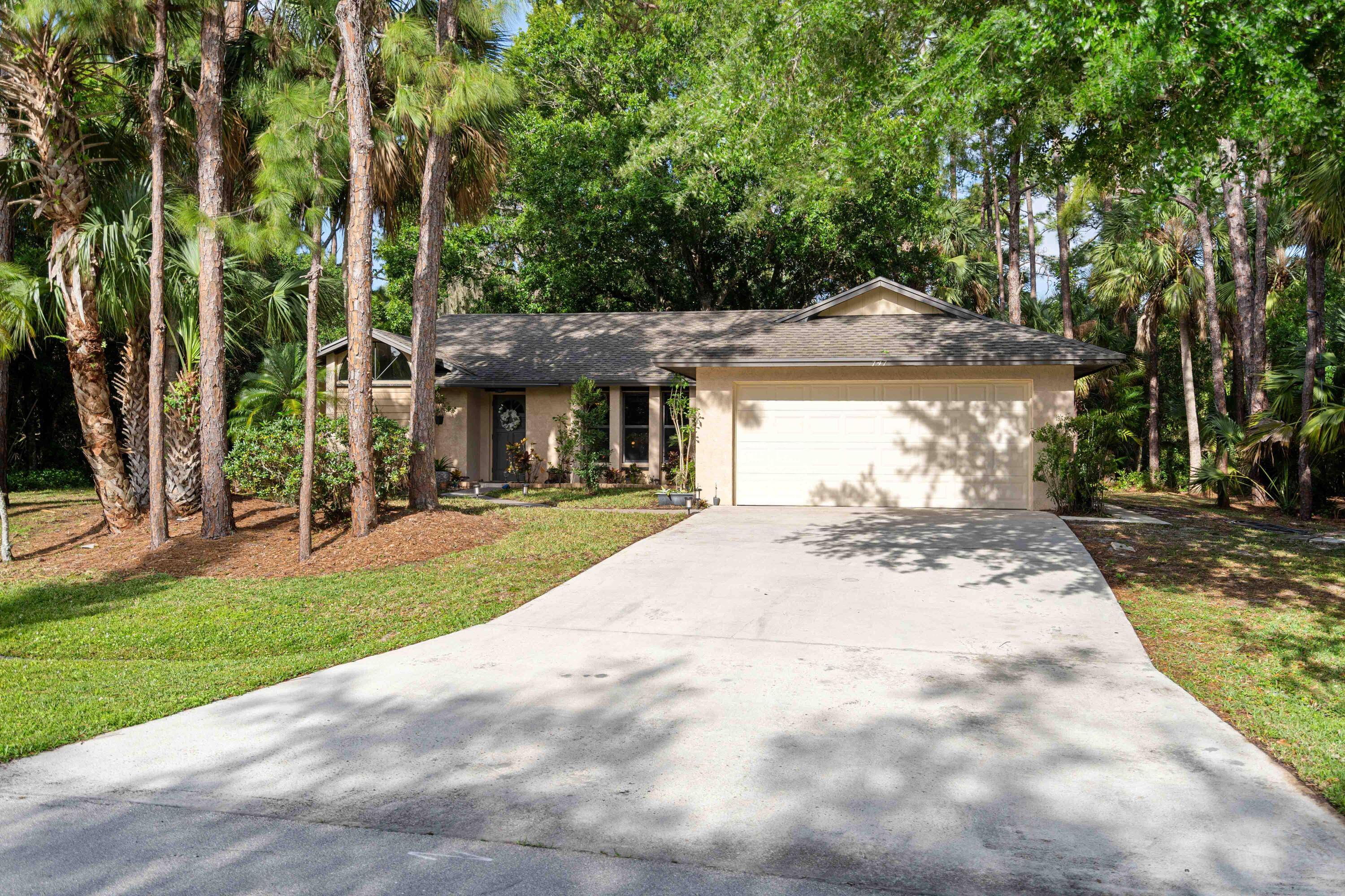 Rare opportunity to own this charming 3 bed, 2 bath CBS gem nestled in a serene oak hammock !