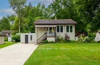 Charming Raised Bungalow on a huge 90 x 160ft lot on a quiet street in a mature, Mount Brydges neighbourhood.