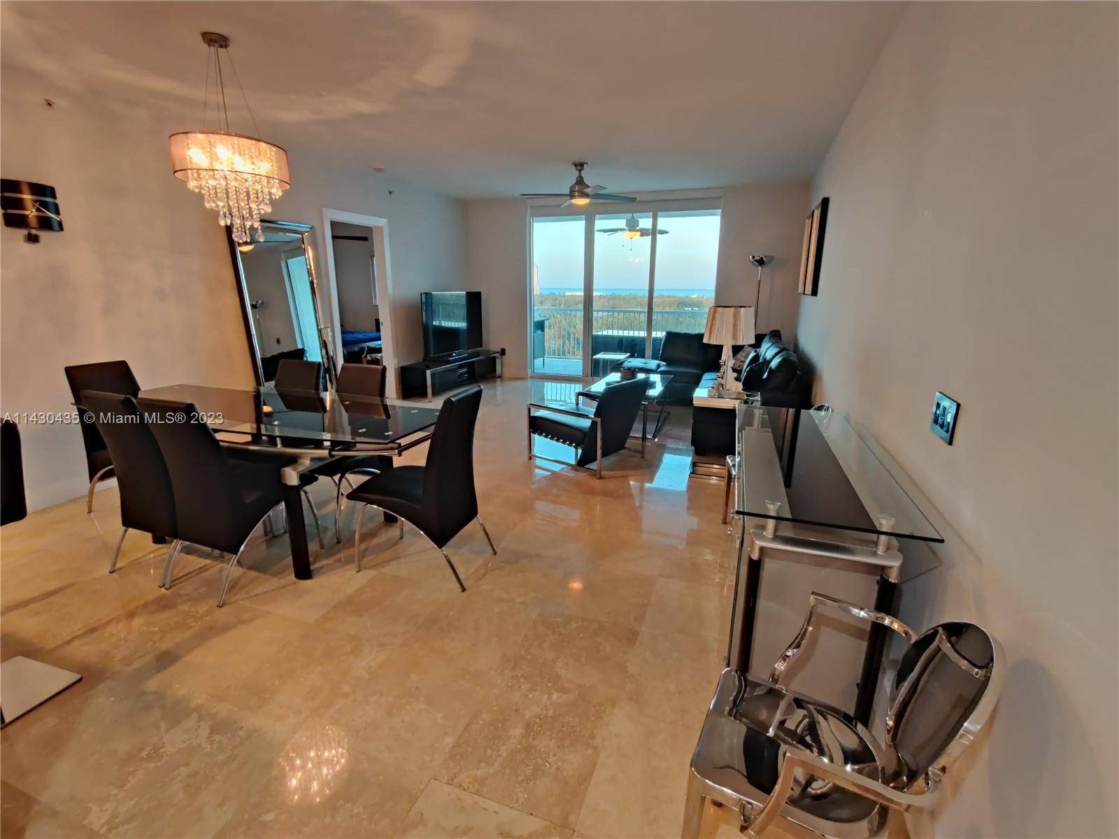 2 bed, 2. 5 bath condo with a mix of marble and laminate flooring, impact windows, laundry room, 3 walk in closets, open balcony with beautiful view.