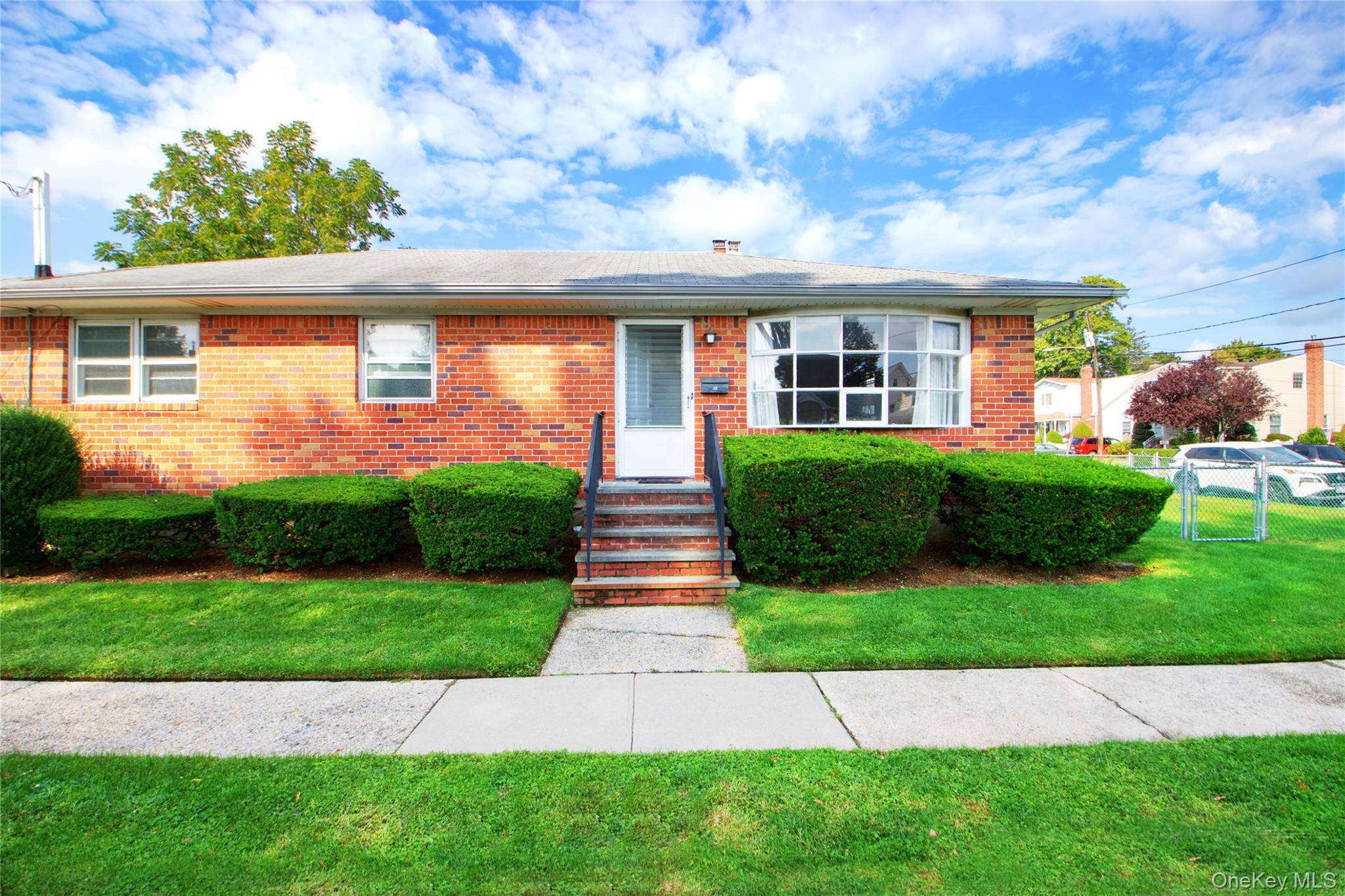 This charming corner property offers the perfect blend of convenience and comfort in the heart of Garden City South, within the desirable Franklin Square school district.