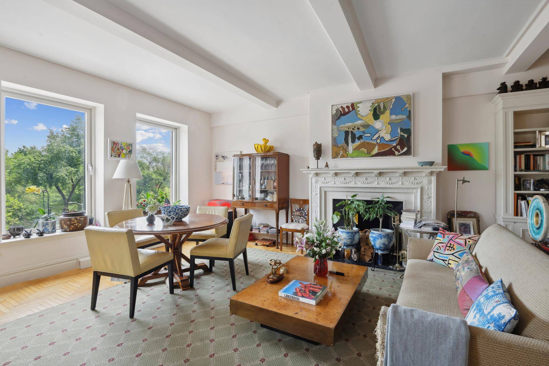 Welcome to Residence 4B at 100 Central Park South A rare offering, this gracious half floor condominium boasts breathtaking, direct views of Central Park through oversized picture windows.