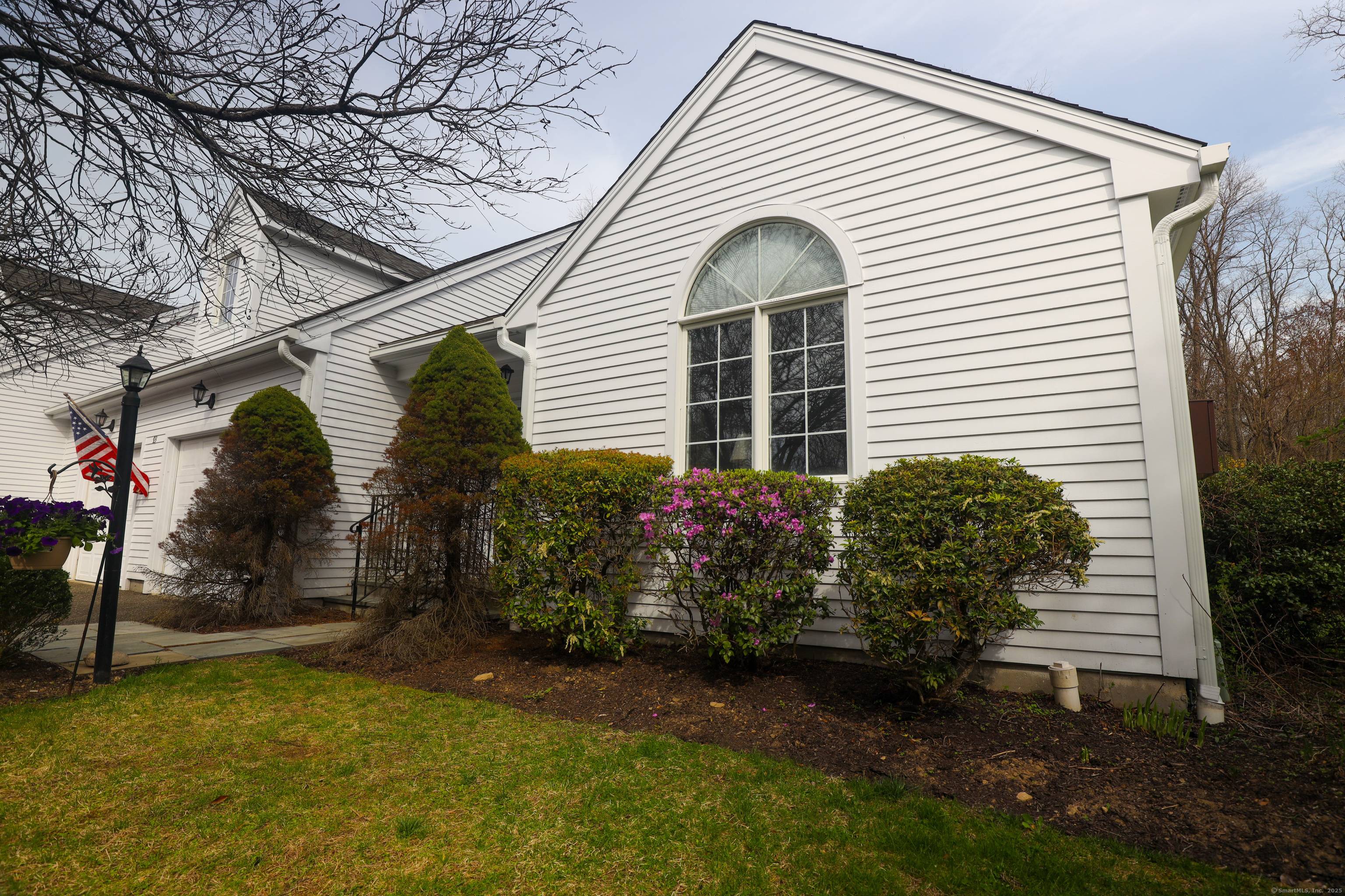 PRIMARY ON THE MAIN FLOOR Spacious and gracious just begins to describe this three bedroom, three bath condominium with privacy and views to boot !