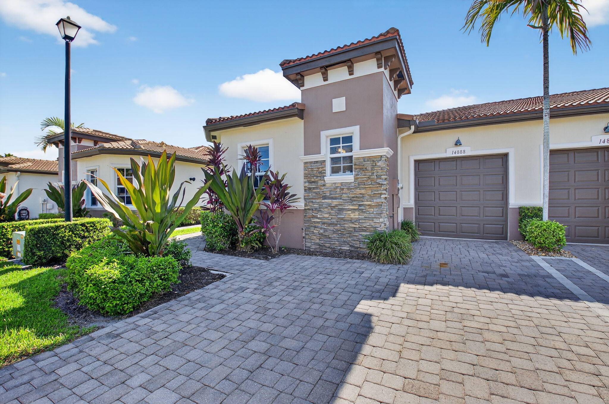 Pristine 2 bedroom, 2 bath and den end unit ''Polina'' 1 car garage villa is close to the clubhouse.