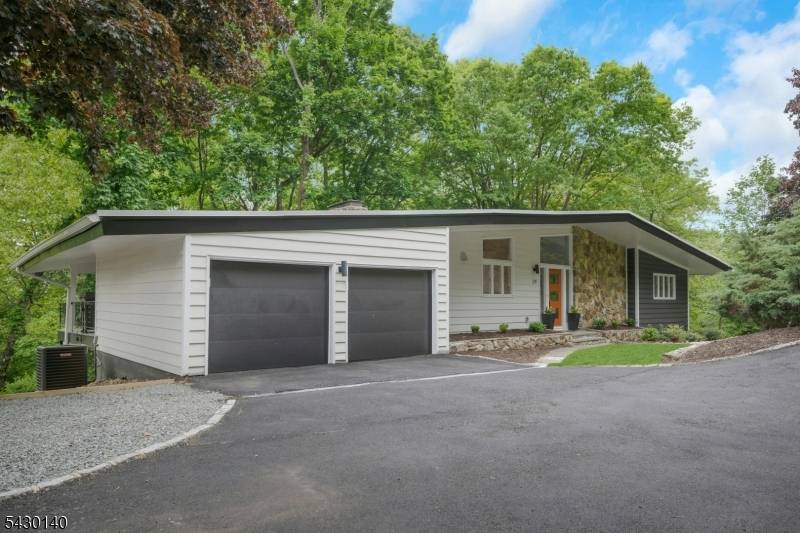 Welcome to this exquisitely curated home near the heart of downtown Morristown, where timeless mid century style meets modern luxury.