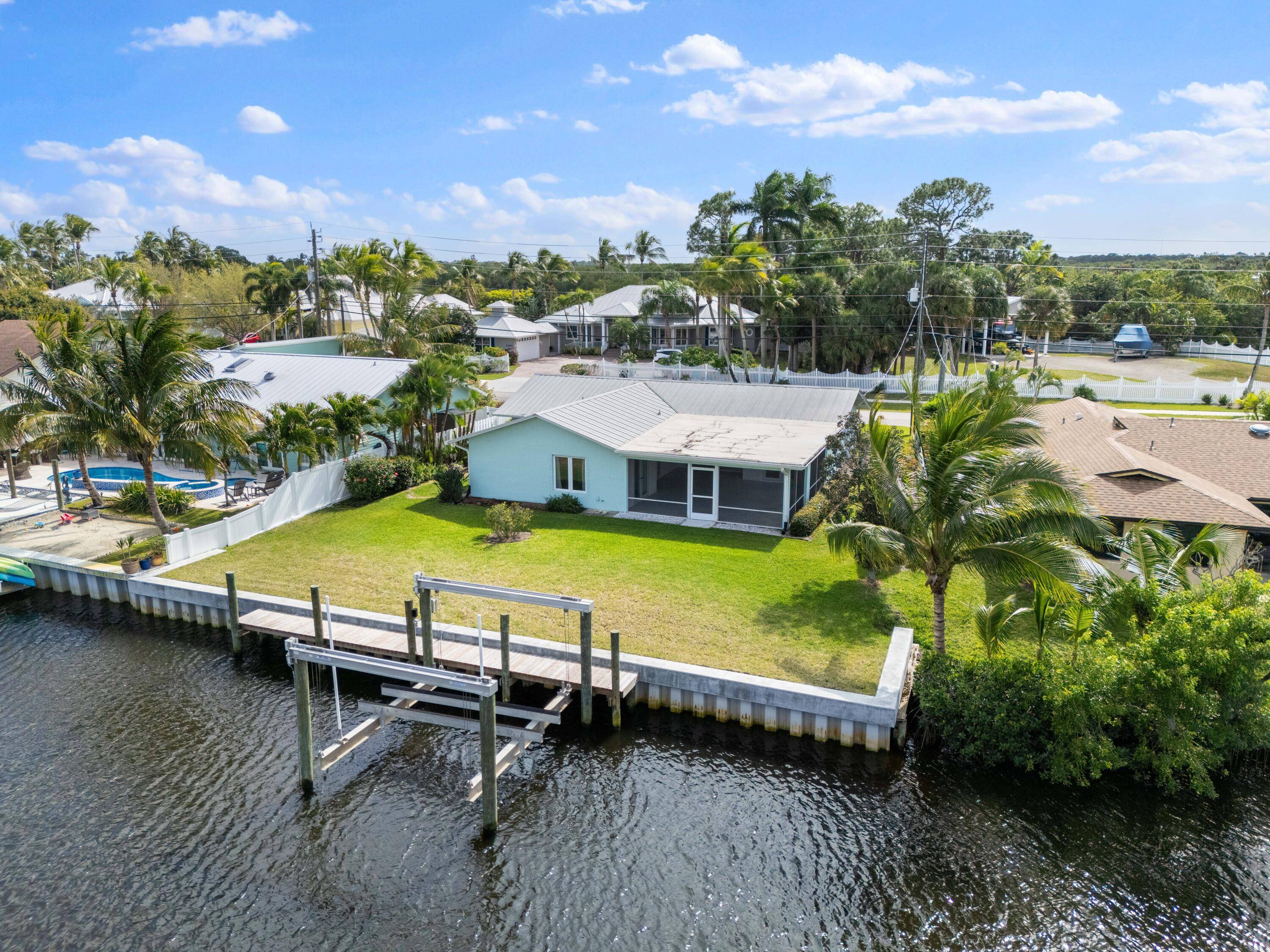 Nestled along the serene waterways of Palm City, this beautifully remodeled 2 bedroom, 2 bathroom home offers the perfect blend of modern amenities and tranquil coastal living.