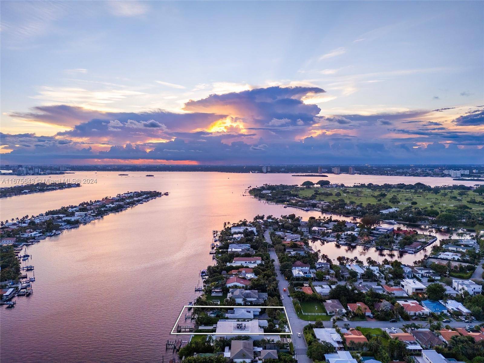 An extraordinary opportunity to create your dream waterfront estate in the exclusive Surfside community.