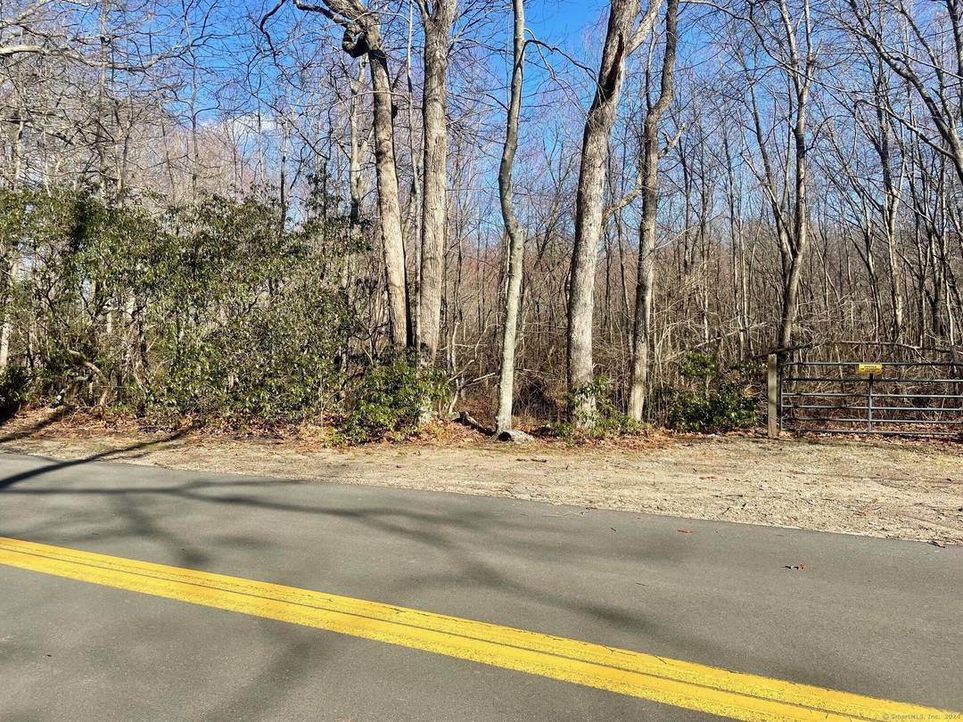 Nestled on 13. 27 acres of pristine raw land, this parcel boasts 617 feet of road frontage, making it easily accessible and highly visible.