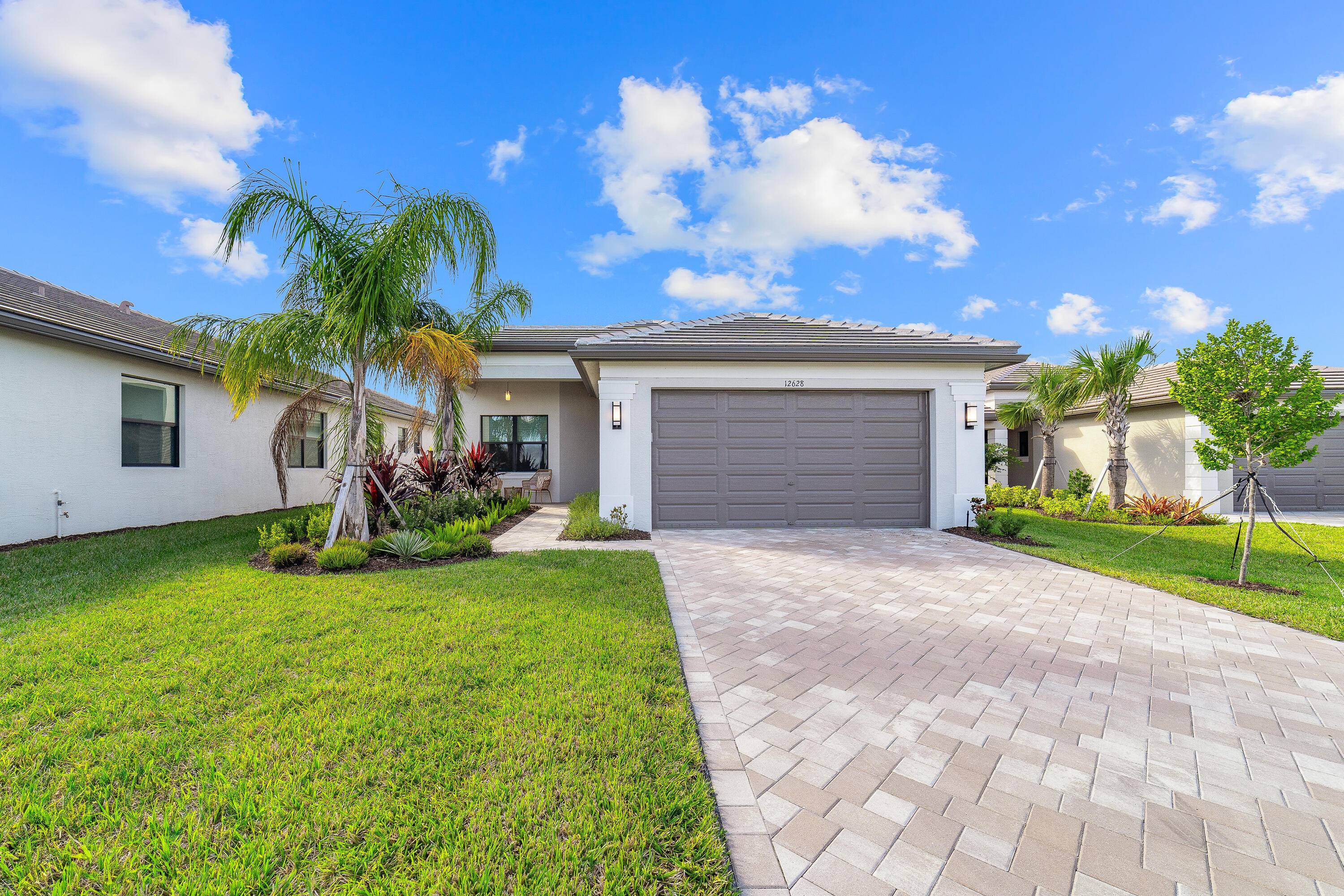 Welcome home to this immaculate, 3 bedroom 2 bath opportunity located in the highly sought after 55 Valencia Walk at Riverland.