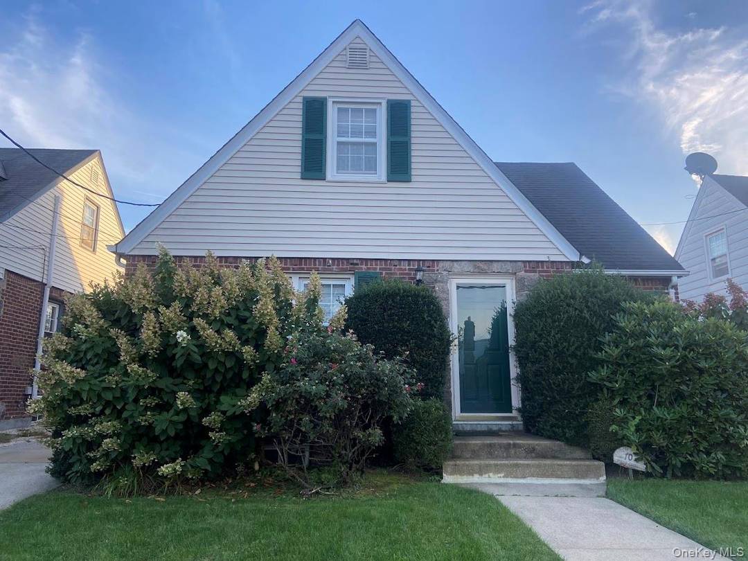 Charming Cape Cod with comfortable Living room, Dining room, and Eat In Kitchen located on a quite tree lined cul de sac.