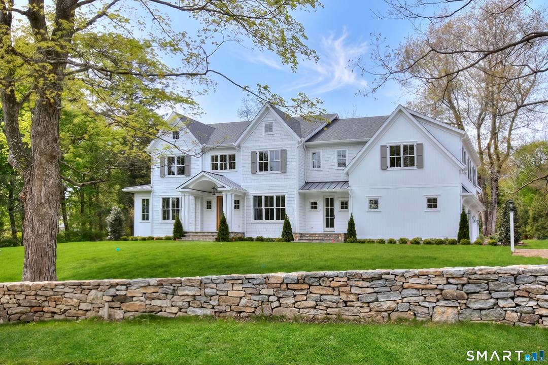 NEW... Stunning transitional 5 bedroom estate blending classic curb appeal with a clean, modern interior beautifully sited on 2.