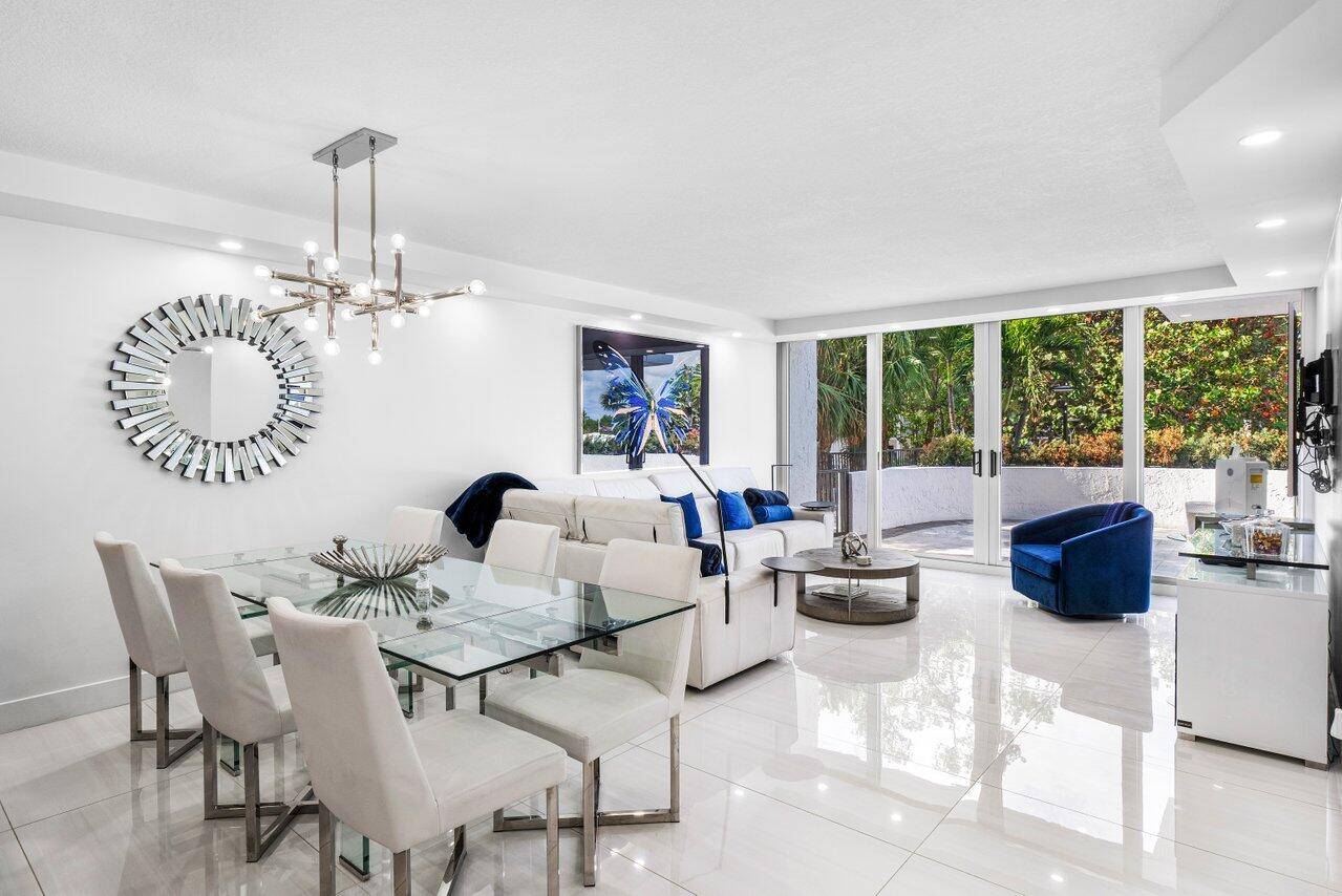 Experience the epitome of coastal luxury in this beautifully renovated condo, where indoor elegance meets expansive outdoor living.