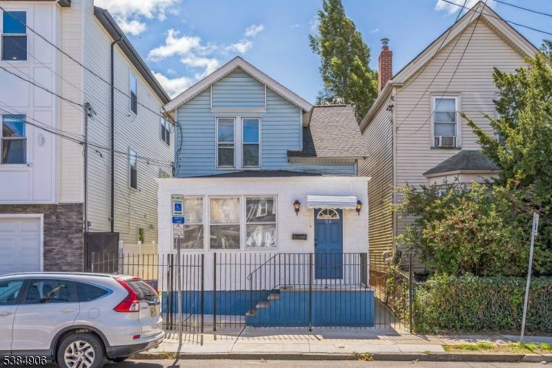 Welcome to 22 Hinsdale Place, a delightful colonial style home nestled in North Newark just minutes from the Belleville border and the picturesque Branch Brook Park.