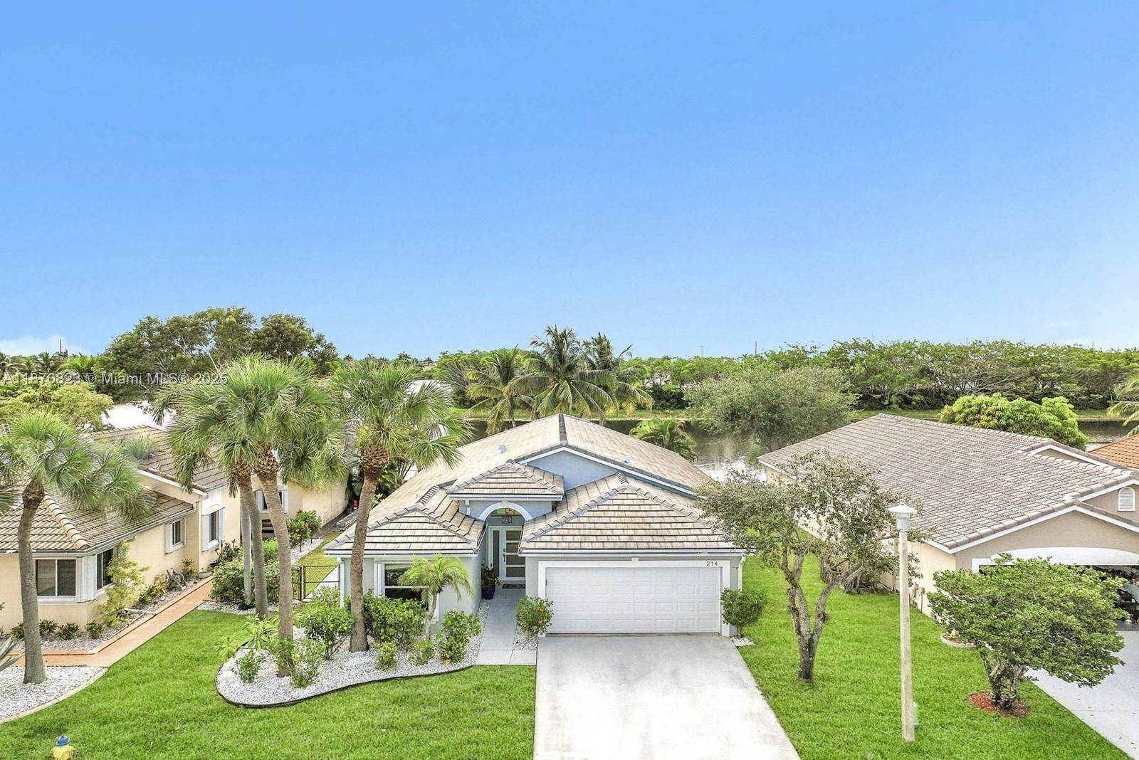 Beautiful re imagined lakefront, one story home with 4 bed, 3 full bath with a super desirable triple split floor plan.