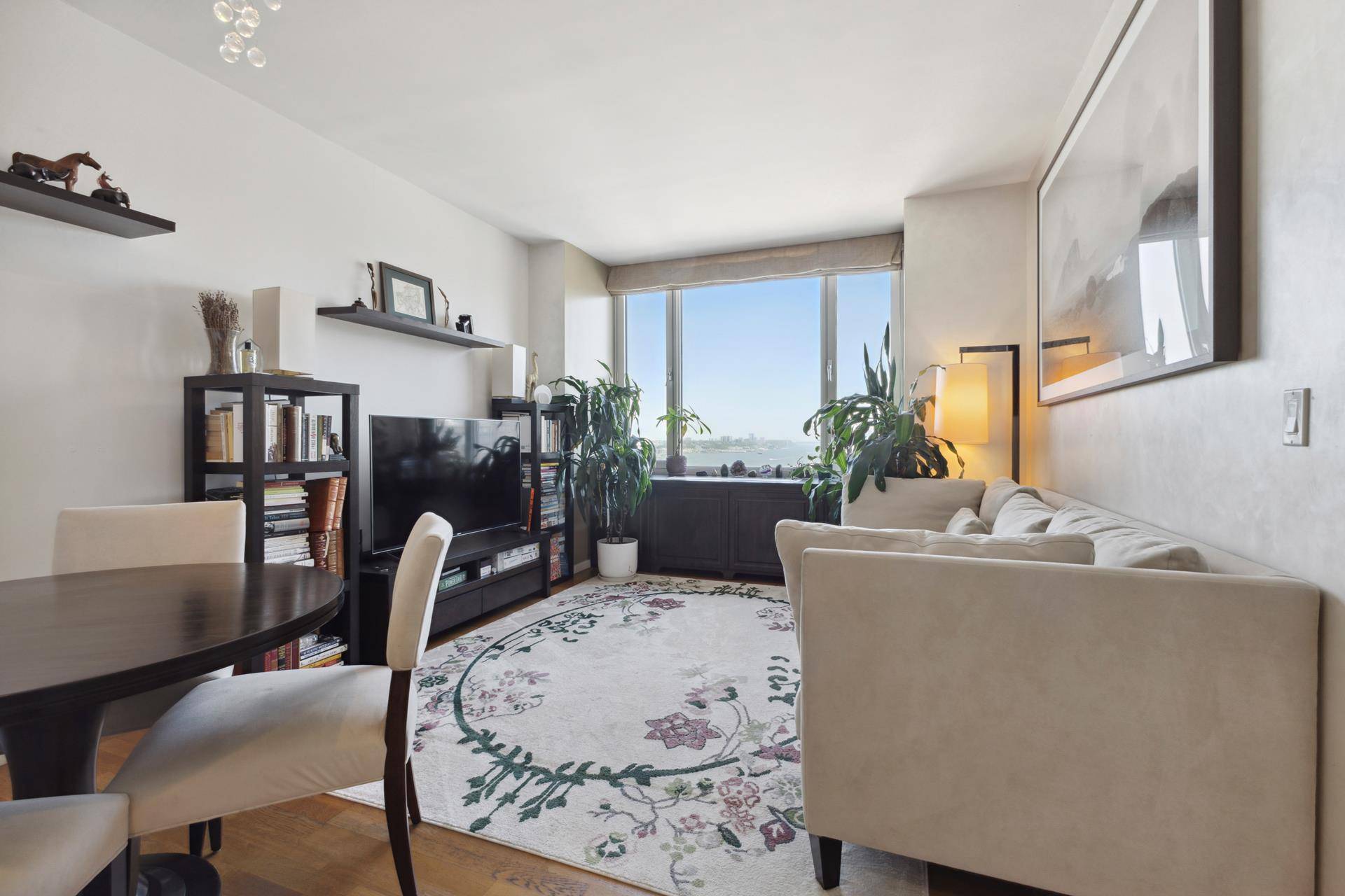 Welcome to this modern north facing two bedroom, two bathroom residence at The Atelier, offering panoramic views of the Hudson River and Billionaires Row.