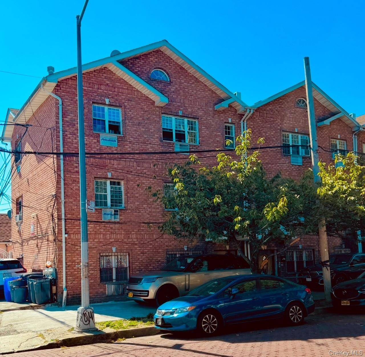 Beautiful newer built next to hillside Ave Three Family Brick Home.