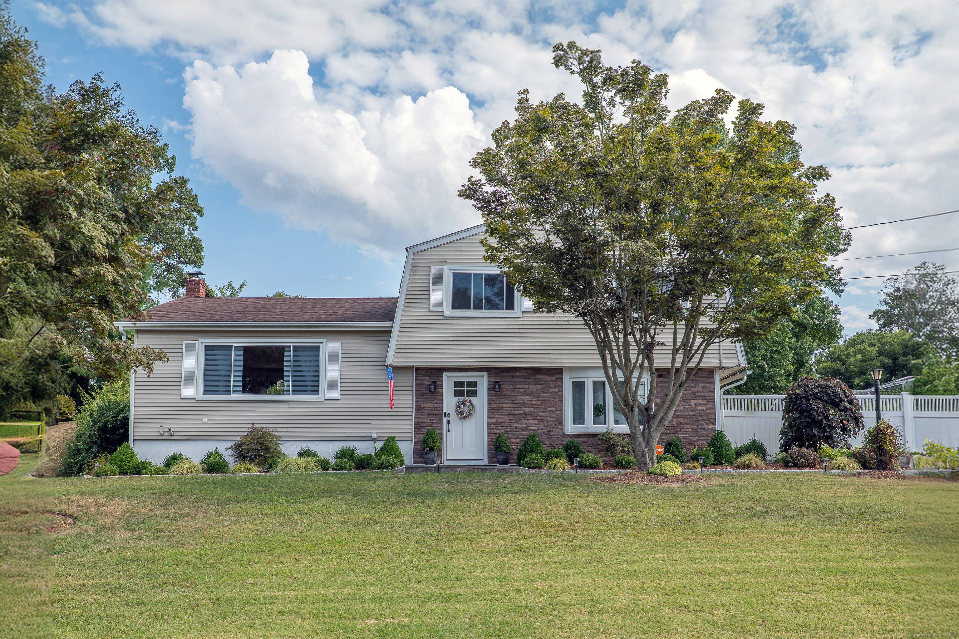 8 Rolling Lane offers modern updates in a quintessential New England neighborhood.