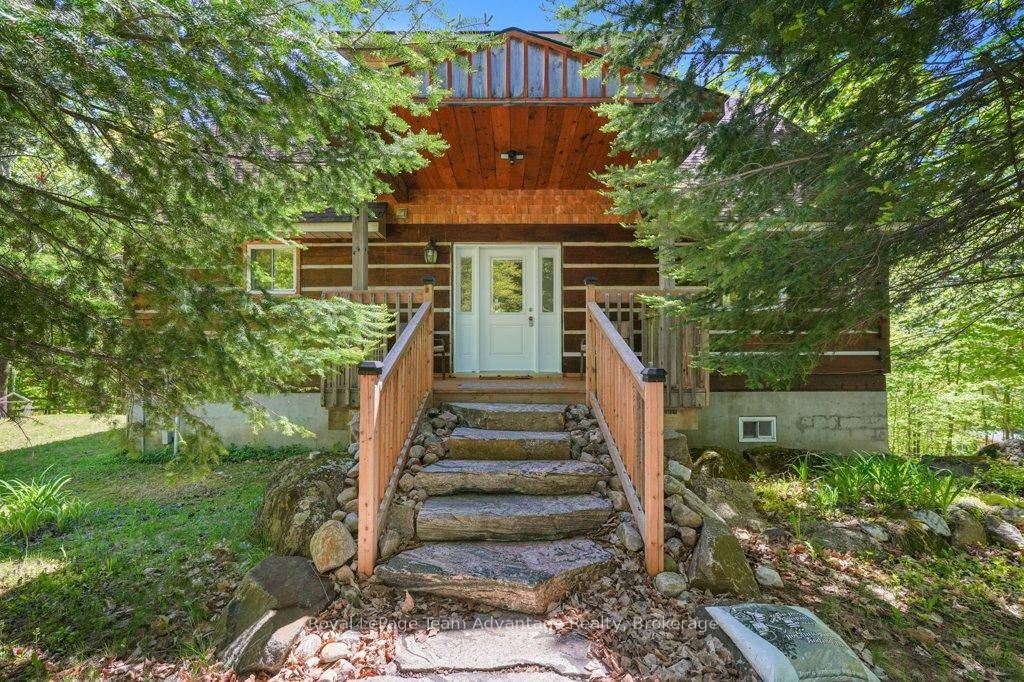 Welcome to 52 Little Otter Lane, a custom, year round retreat nestled on the peaceful shores of Little Otter Lake in Seguin.