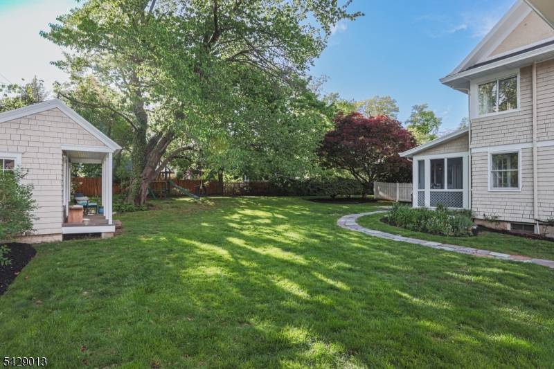 Ideally situated just moments from Upper Montclair Village, this handsome five bedroom, 2.