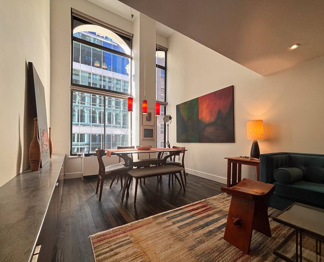 NEW PRICE ! EXCELLENT CONDITION DOUBLE HEIGHT 16 WALL OF WINDOWS Bright, recently renovated duplex loft with 16 Ceiling in Greenwich Village's much sought after historic Cast Iron Building.