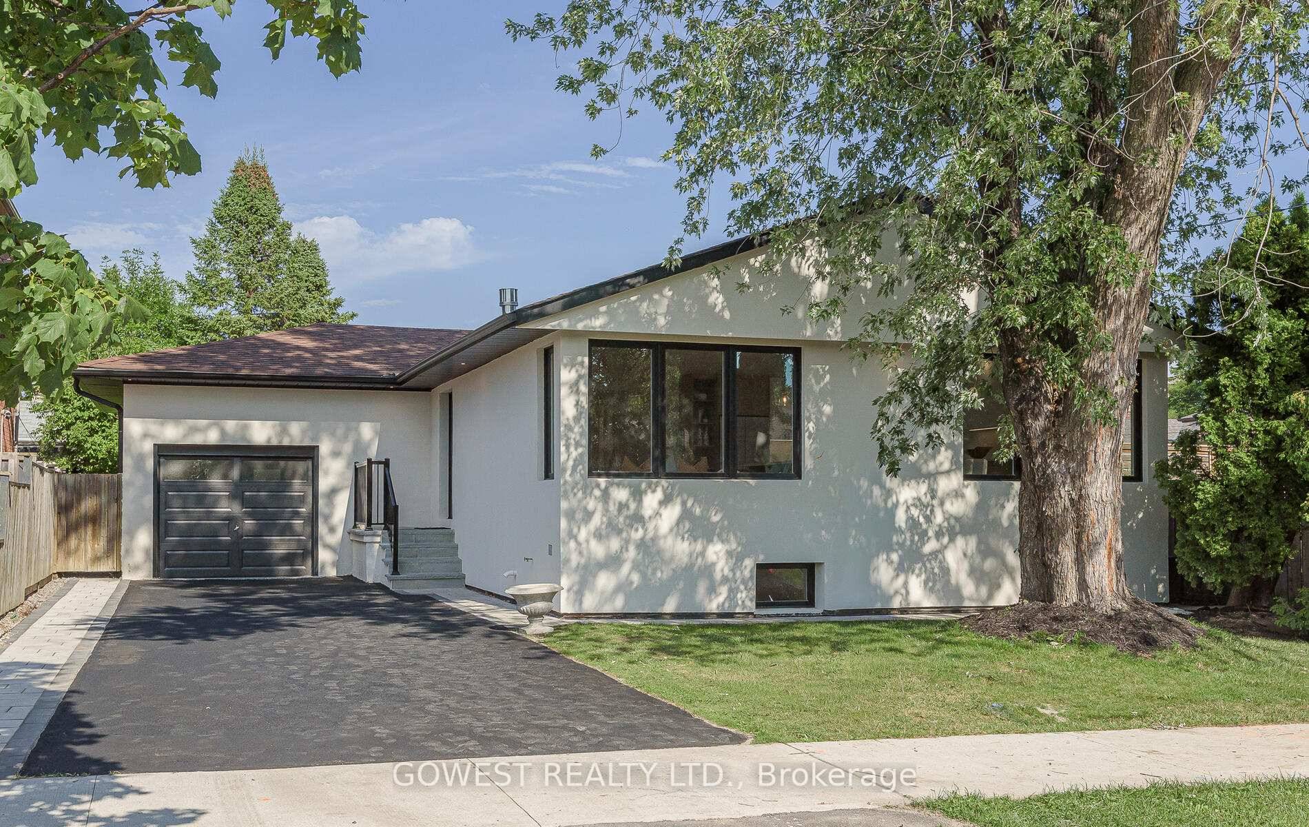 This beautifully renovated detached Raised Bungalow in Etobicoke's desirable West Mall neighbourhood combines timeless charm with luxury modern finishes.