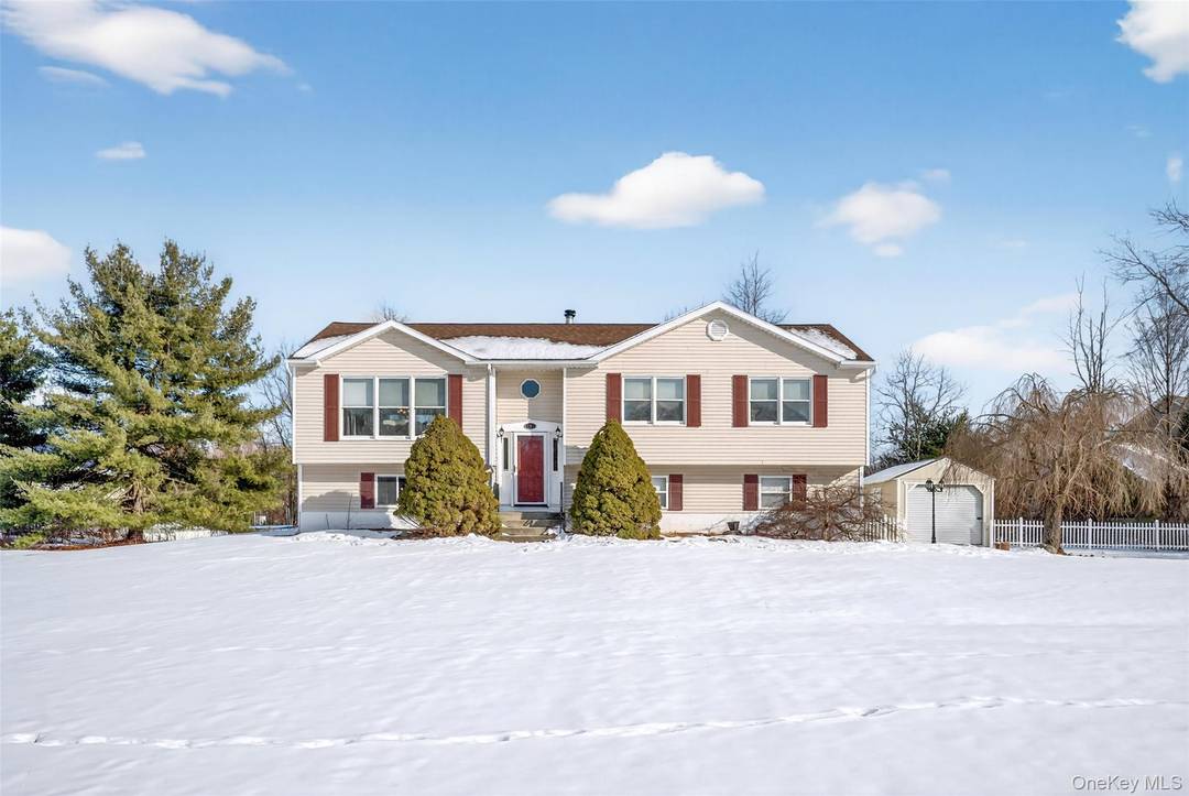 Set on a cul de sac, this four bedroom, three bath home sits on a flat, just under an acre lot and offers a layout that lives larger than expected.