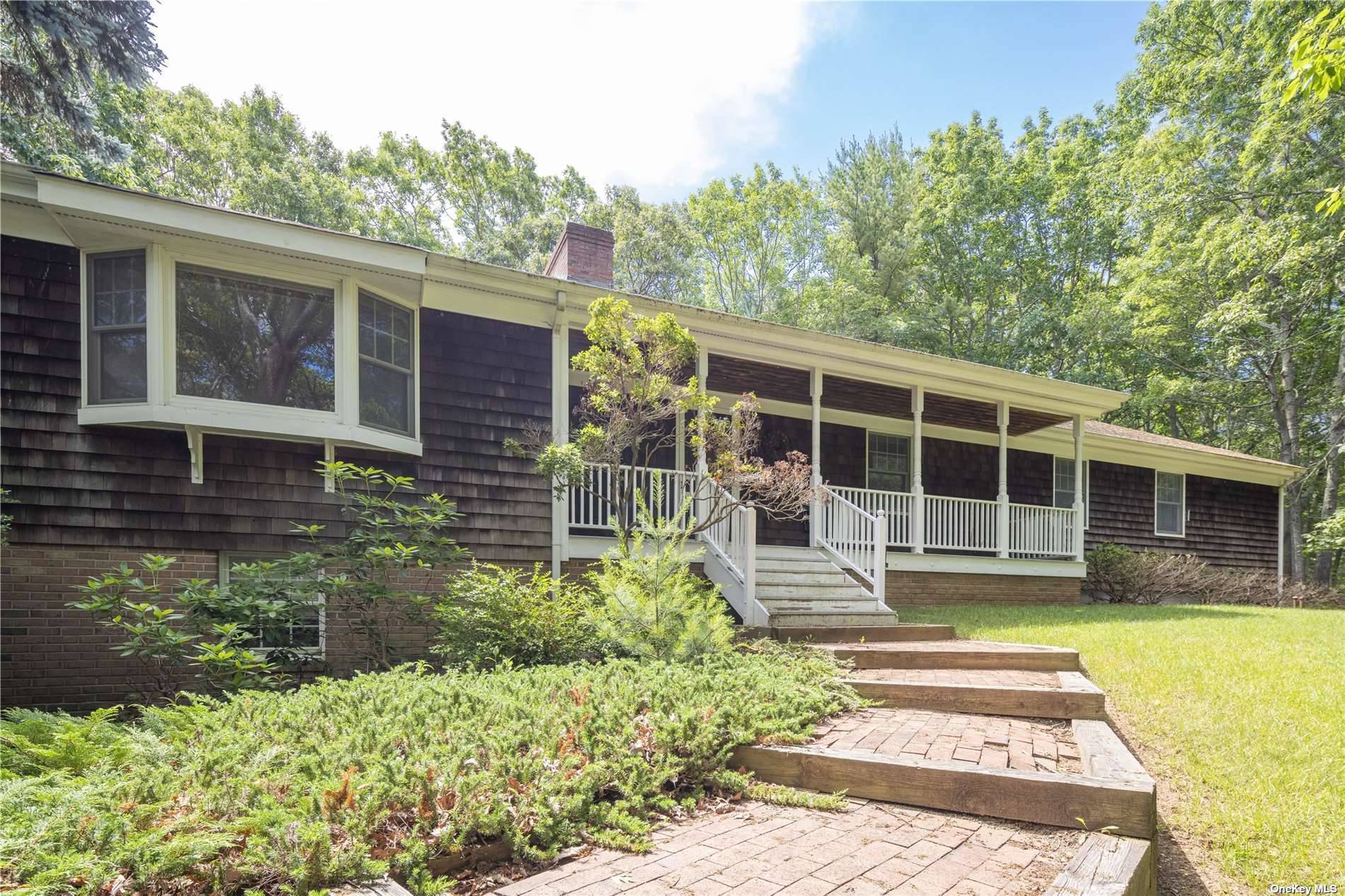 Discover the charm of this Nassau Point cedar shake sprawling ranch, perfectly situated on a shy acre with room for a pool.