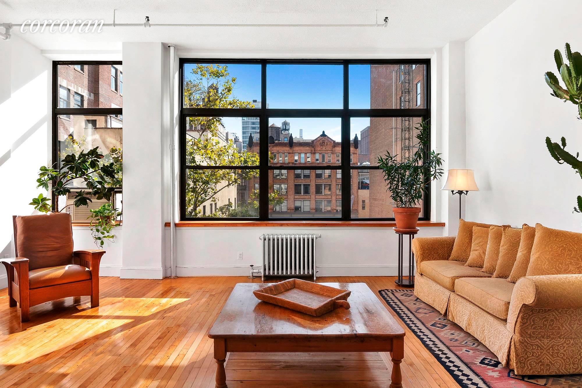 This sun filled 1350sf loft with soaring 12' high ceilings in the heart of NoHo is a great find !
