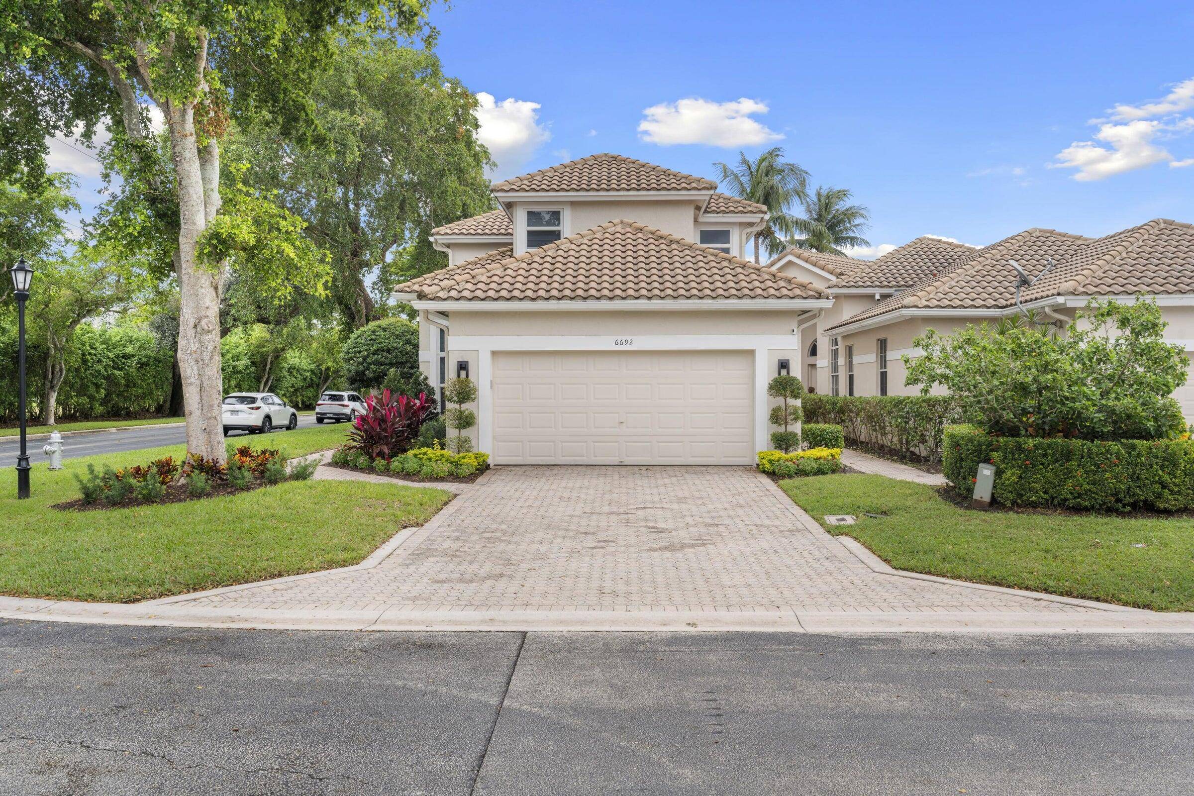 Discover unmatched elegance at this one of a kind corner lot home in the highly sought after gated community of Broken Sound !