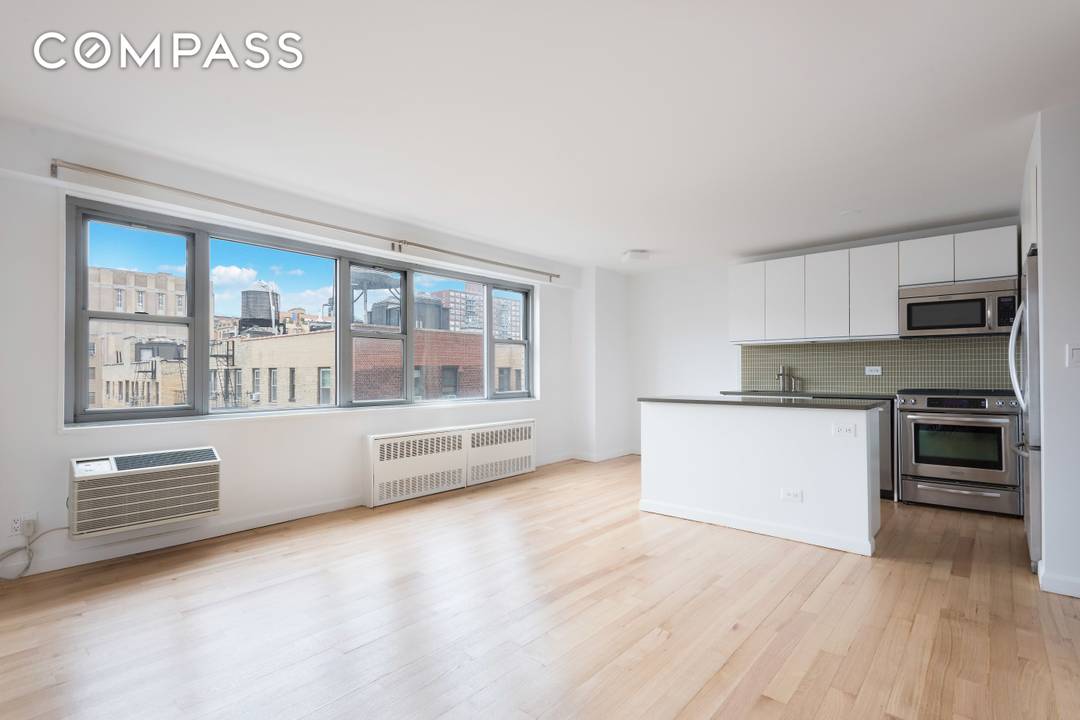 Welcome to this beautifully renovated studio with oversized windows, great natural light, and open western city views.