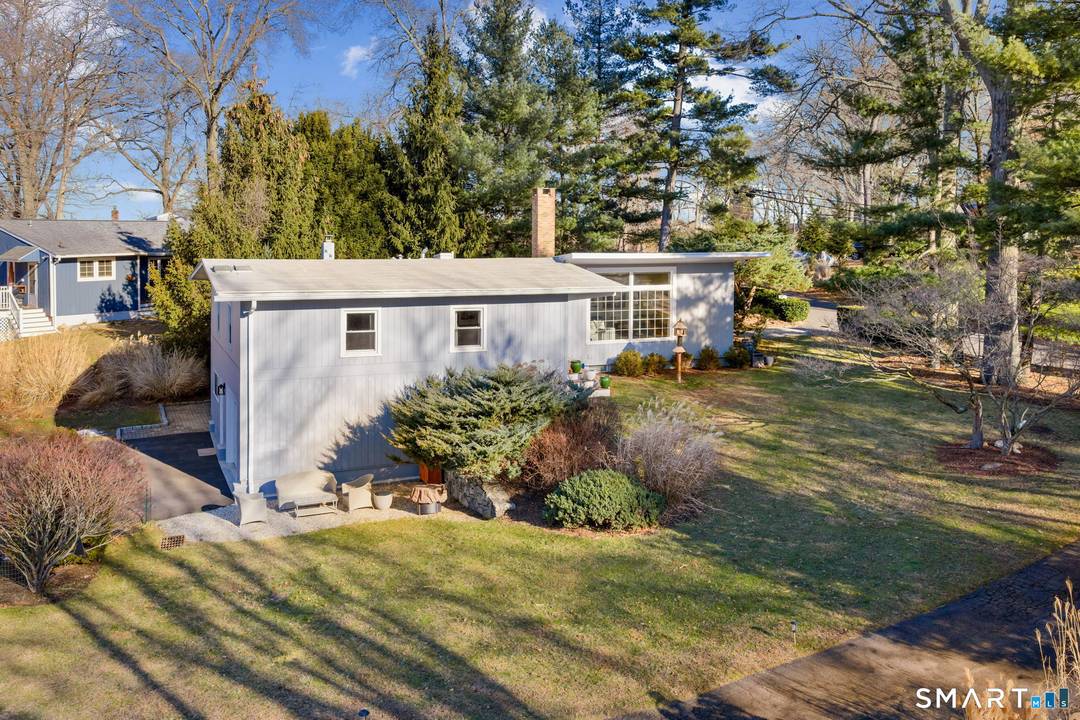 Located in Norwalk's best kept secret, this renovated mid century modern home is set within the sought after coastal community of Village Creek.