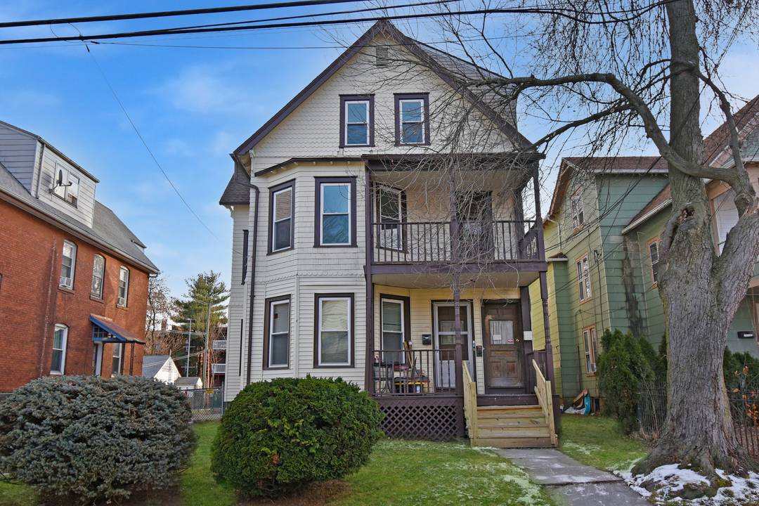 Updated Hartford 3 family featuring two 3BR units and one 2 3BR unit.