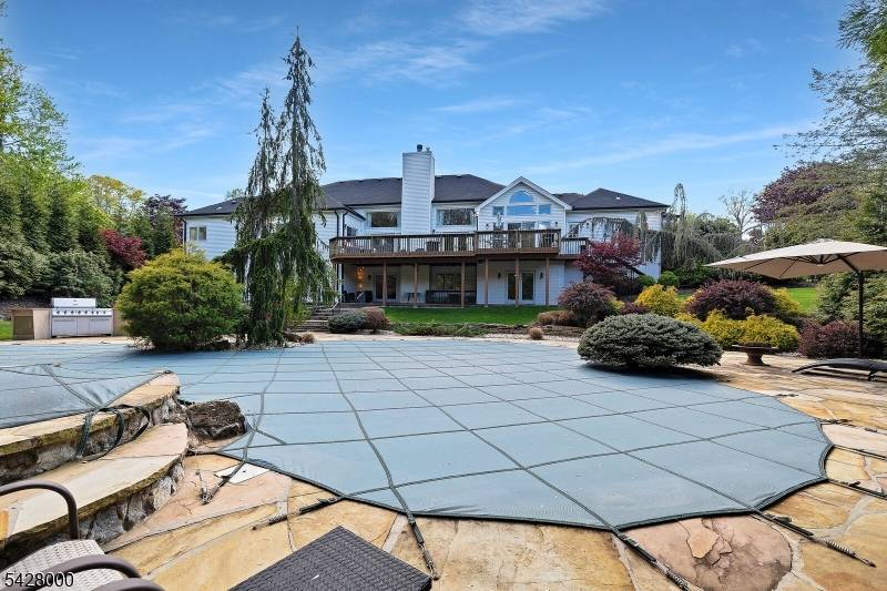 Set on a circular drive in one of Warren's most desirable neighborhoods, this custom contemporary ranch offers a resort style property and over 6, 000 sq ft of refined living, ...