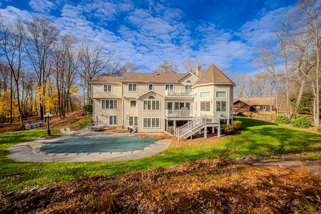 Located on a serene cul de sac in desirable Orange, this beautifully designed 4 bedroom, 3.