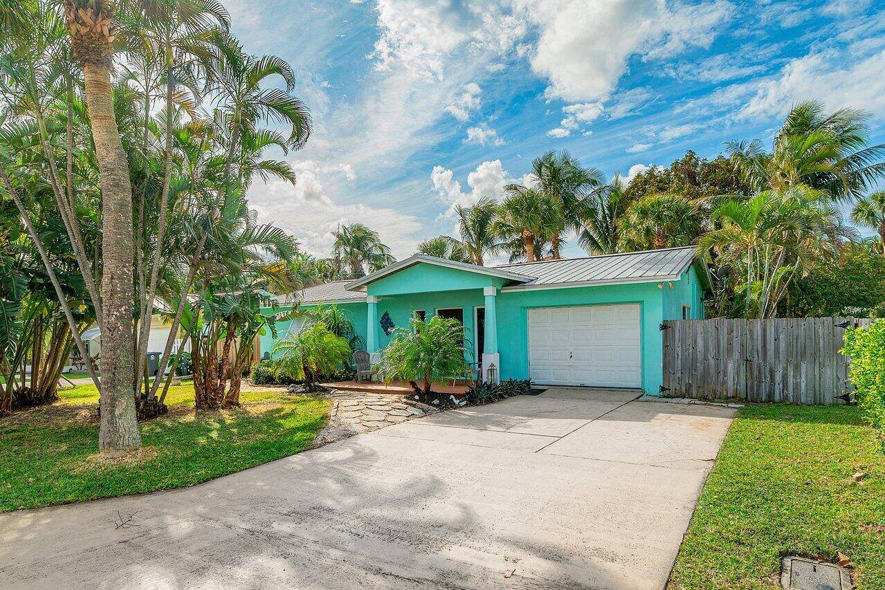 Just one street away from the Intracoastal Waterway, step into this open floor plan designed for effortless entertaining.