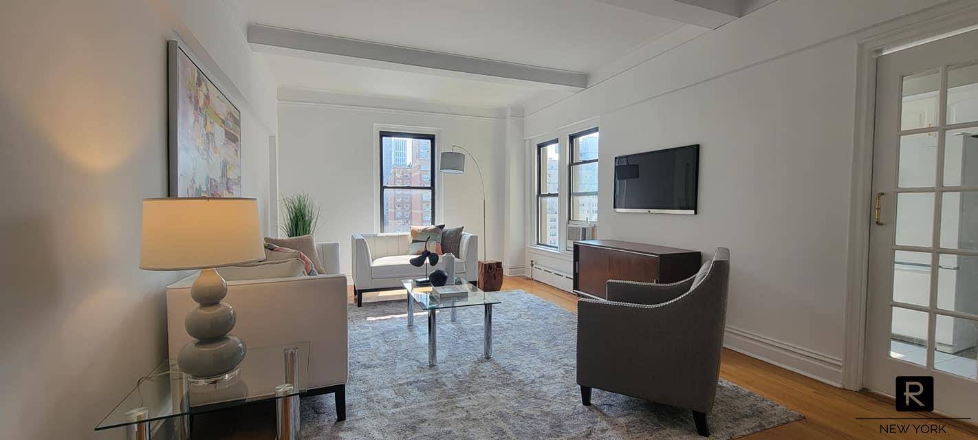 A PREWAR GEM ! Situated on a high floor with three open exposures, this tranquil 2 bedroom residence has extraordinary light and city views.