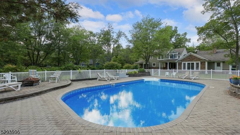 This exquisite 5 bedroom Colonial on 1.