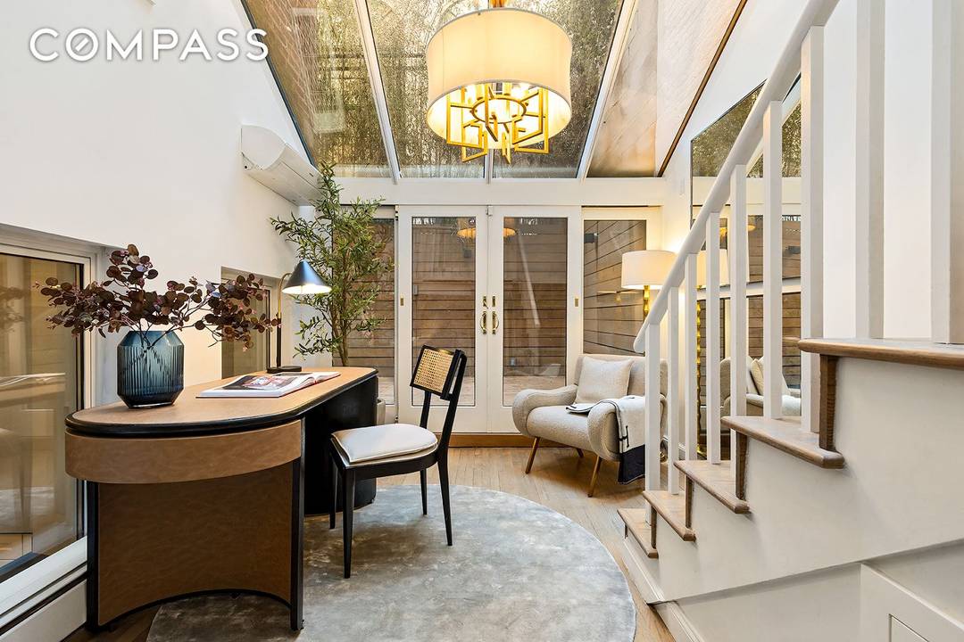 A rare and sophisticated south facing garden duplex nestled within a historic landmarked mansion on one of Manhattan s most coveted blocks just moments from Central Park.