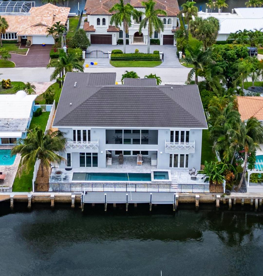 807 Dover Street, a 2021 custom built in Boca Raton's exclusive Bel Marra on 85 feet of waterfrontage, and direct ocean access with no fixed bridges, which offers a seamless ...