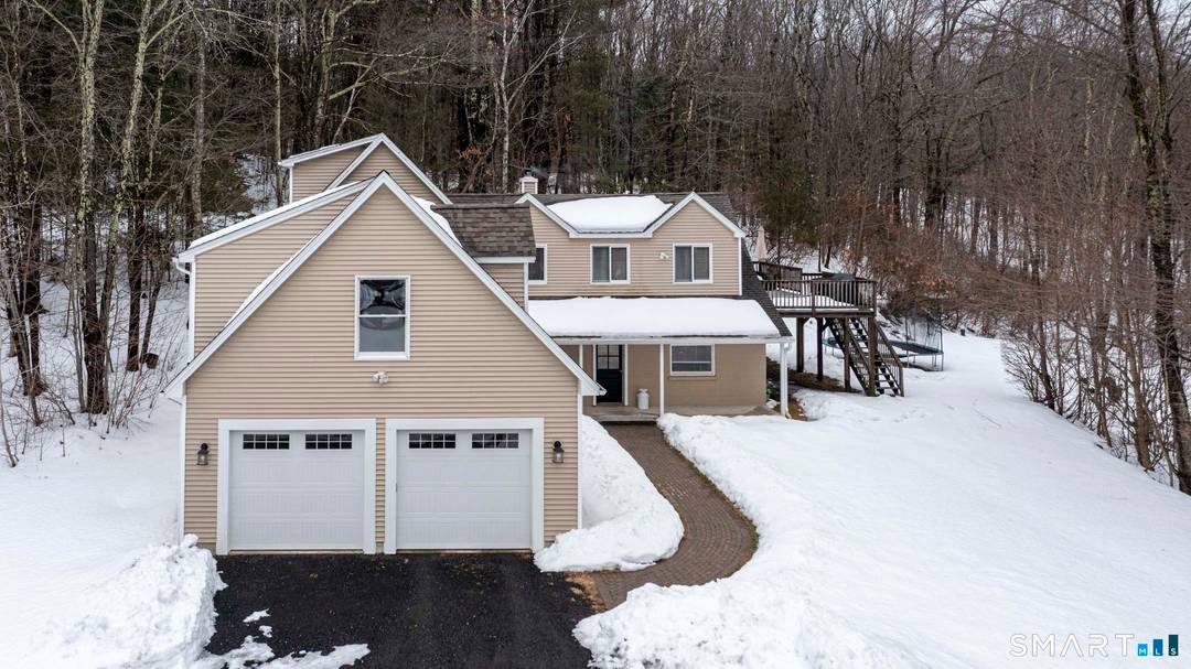 Welcome to this beautifully updated home in the heart of picturesque Morris where modern upgrades meet natural serenity.