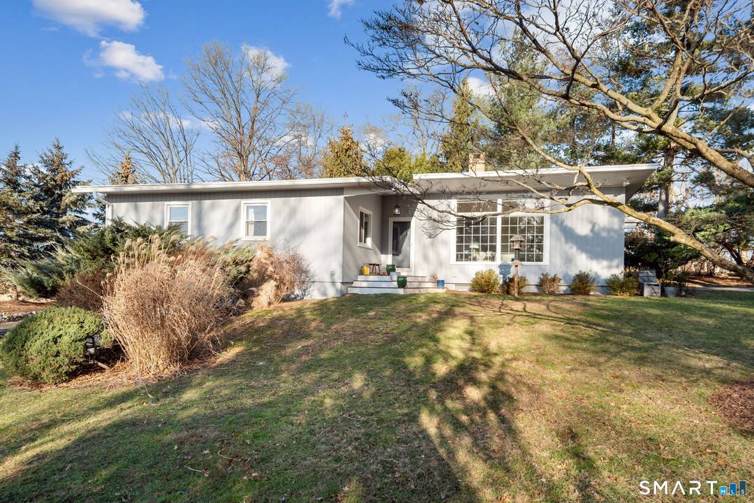 Located in Norwalk's best kept secret, this renovated mid century modern home is set within the sought after coastal community of Village Creek.