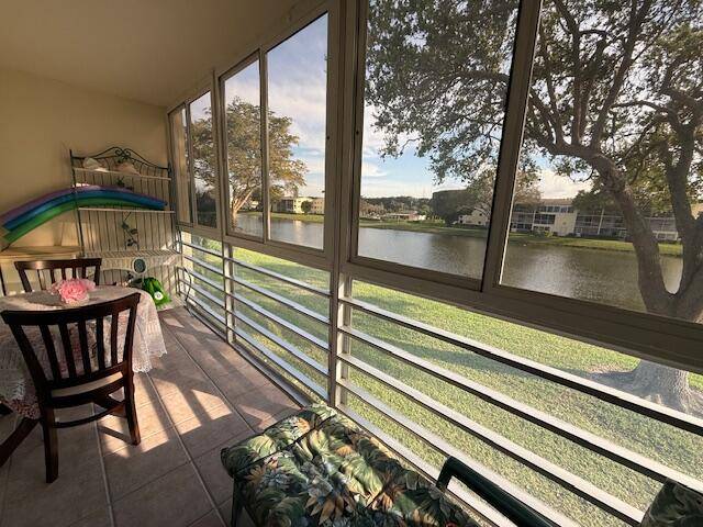 Wake up each day to a Cheery, Cozy, and Bright condo with a Beautiful Lake View, Enclosed Patio with Sliding Windows, Central air conditioning, FULLY FURNISHED, TURNKEY.
