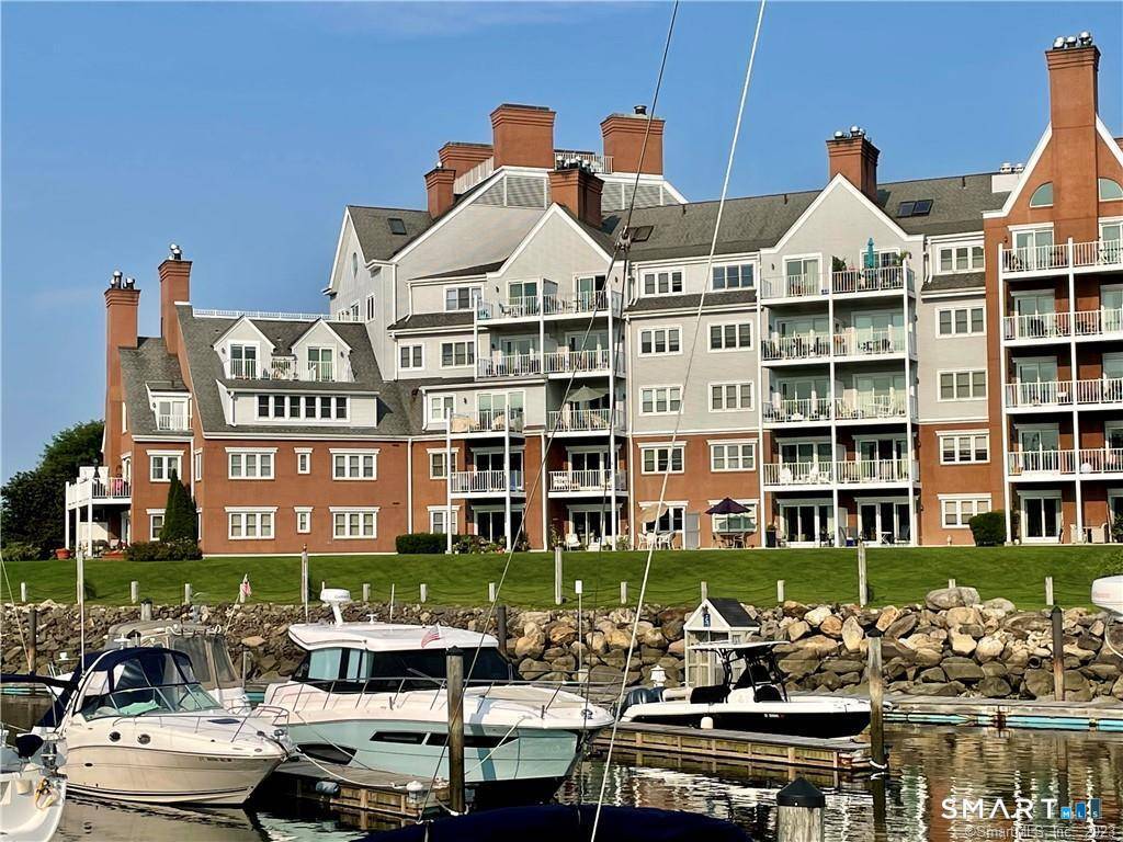 Highly sought after, beautifully updated 2 bedroom, ground floor 2 bath unit with stunning water views and the largest, private patio in the complex overlooking the marina.
