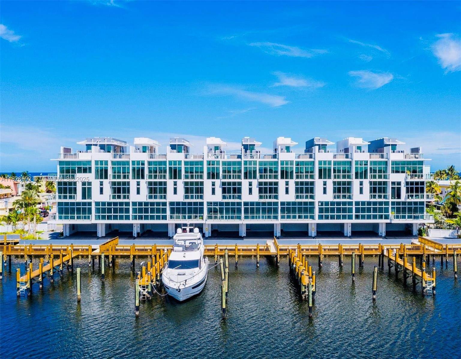 Experience luxury waterfront living in this premier corner residence at the exclusive QUINT Collection Hollywood.